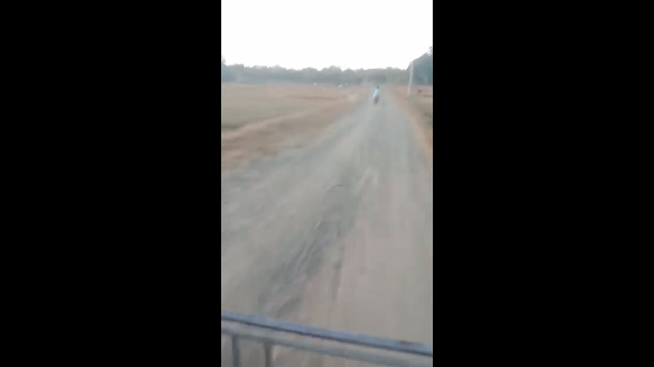 Six years old driving pocket rocket bike in the highway