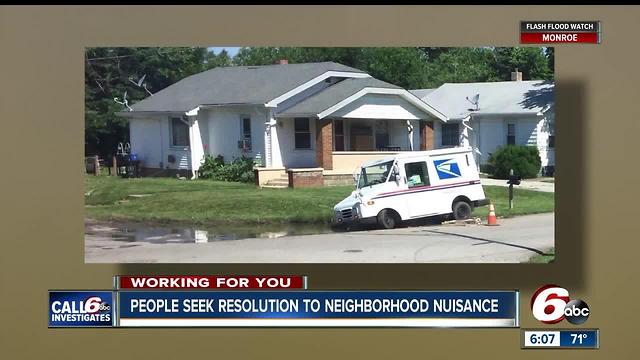 Mail truck gets stuck in sinkhole on Indy's southwest side