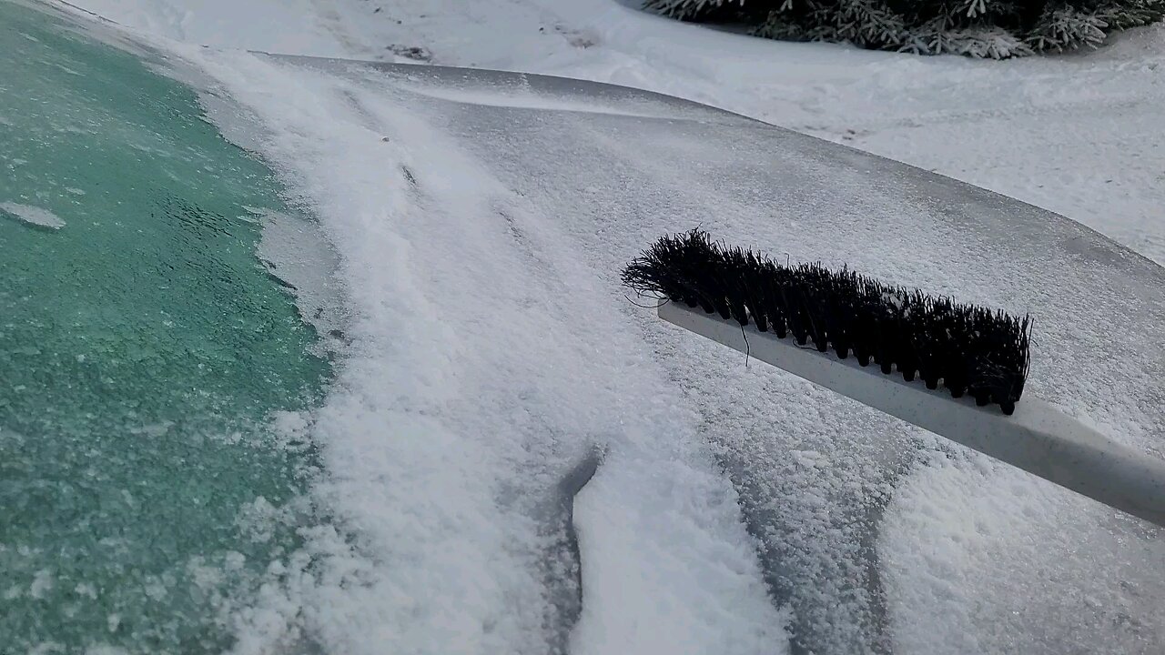 Satisfying ice sheet sliding off car.