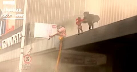 Baby thrown from building 'set on fire by looters' in South Africa
