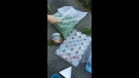 Kid Picks Out Beads for Photo