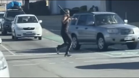 Road Rage Lunatic Smashes Cars With Baseball Bat