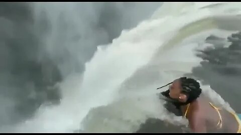 Hanging off waterfall for Instagram likes
