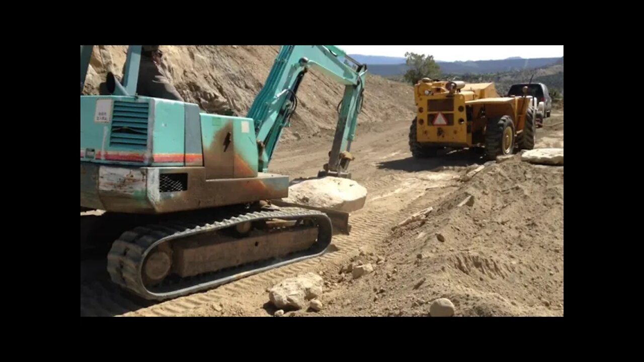 YB 451 Yanmar Excavator Moving Big Rocks