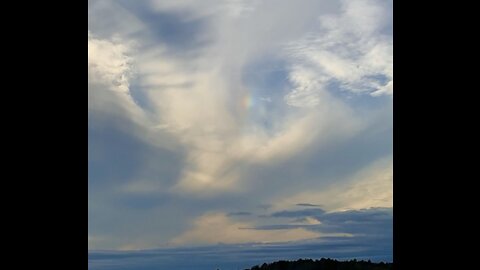 Beautiful Thanksgiving day skies with two small rainbows