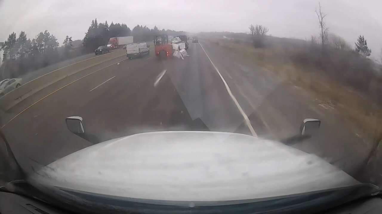 Load falls off flatbed on highway