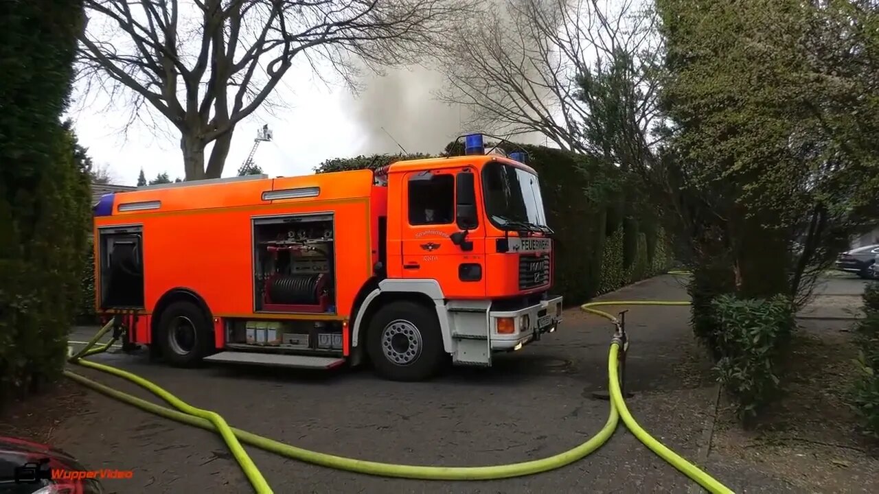 14. Smoke billows from thatched cottage fire