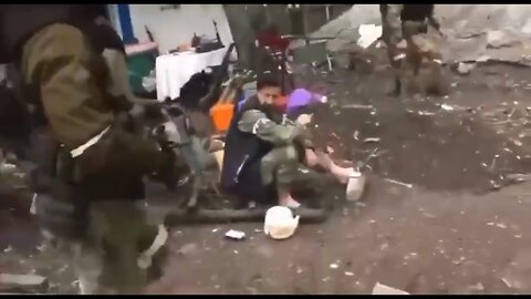 Chechen soldier plays with a chainsaw