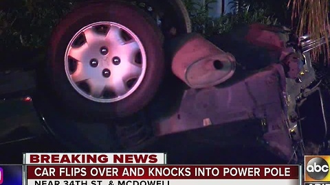 Car crashes into power pole, knocks out power for hundreds of people