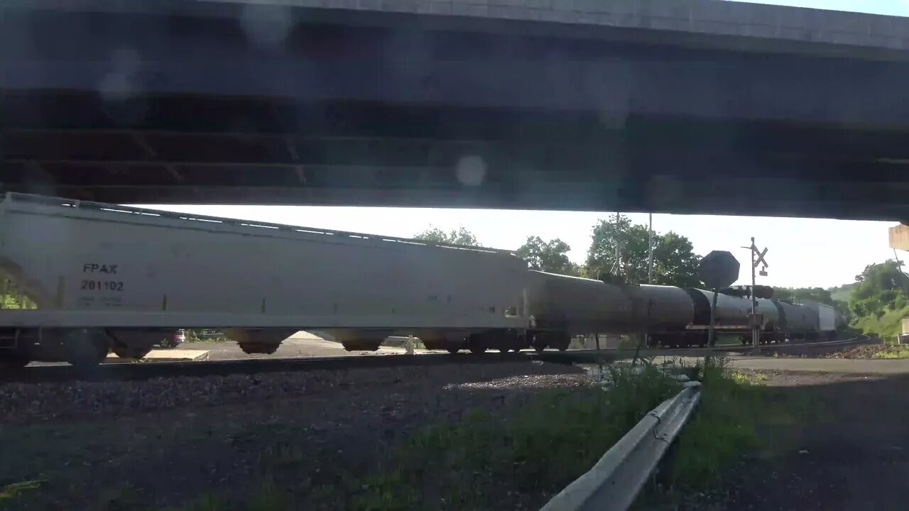 A mixed every stuff/intermodal passes under 219