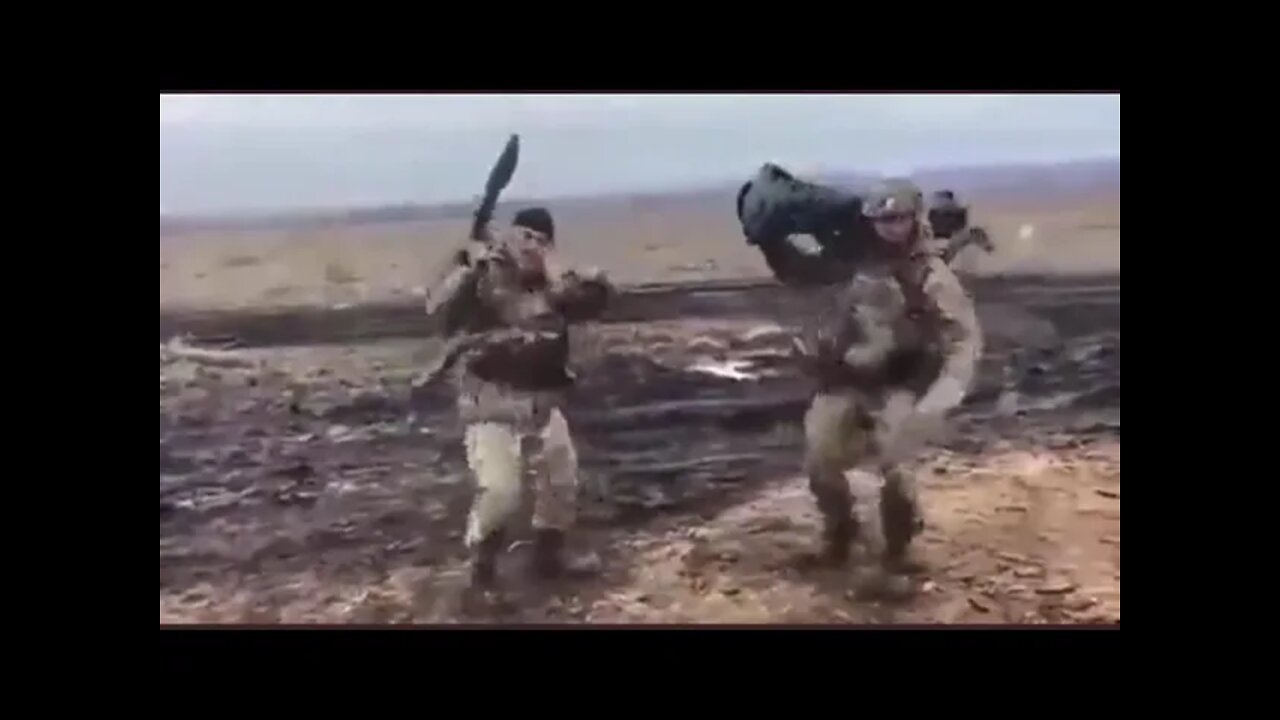 Ukrainian soldiers, after destroying a Russian tank with a Javelin missile.