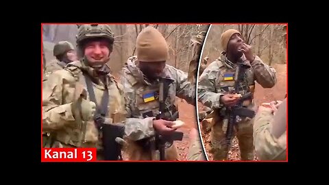 Ukrainian soldiers host an American soldier with their national meal