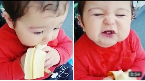 Cutest baby boy ever chows down on tasty banana