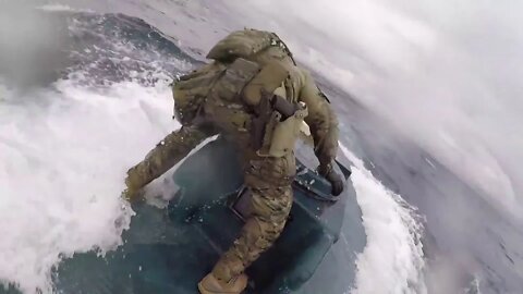 US Coast Guardsman jumps onto moving drug-smuggling submarine and bangs on hatch