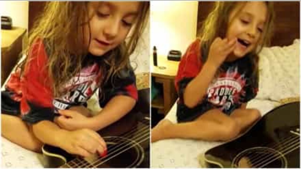 Padre e figlia suonano la chitarra insieme