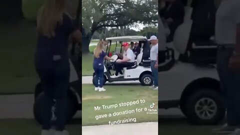 Trump stopped golf cart to give a donation to a school fundraiser