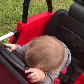 Sleepy Baby Falls Asleep Behind The Wheel