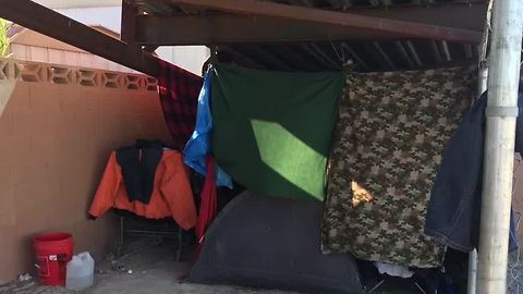 Homeless camp on pedestrian bridge worries some near middle school