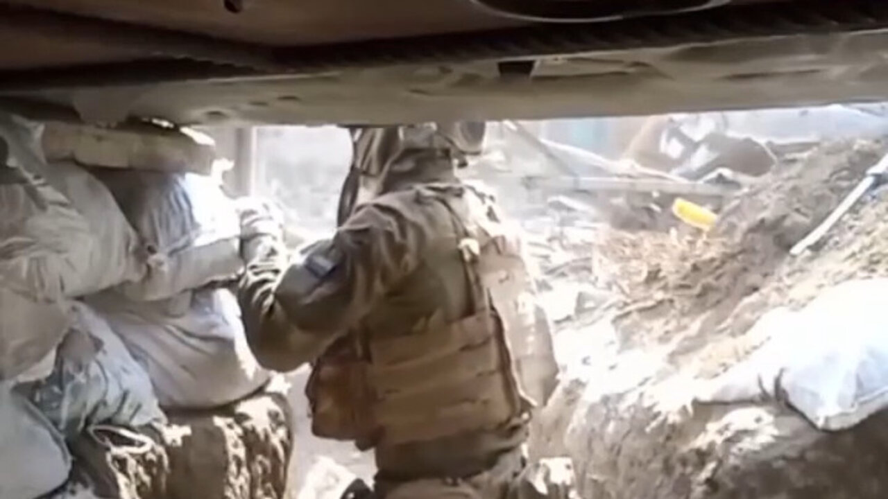 Ukrainian soldier peeks out of trench fortification and nearly gets killed