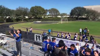 UF football coach surprises Wellington star with scholarship