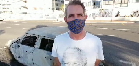 Two people on a motorbike alleged to have torched Sea Point resident's car (67k)