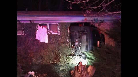 Car Crashes into House