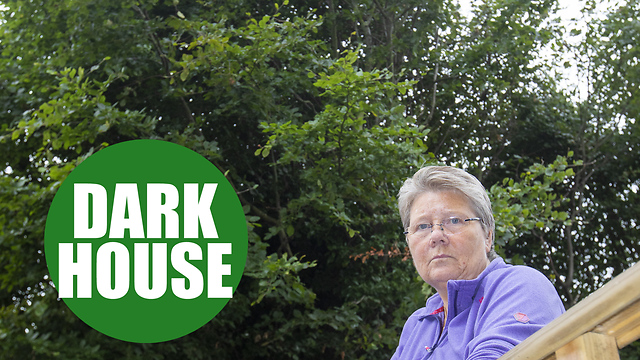 A woman says she's living in darkness because of a 42ft tree behind her home