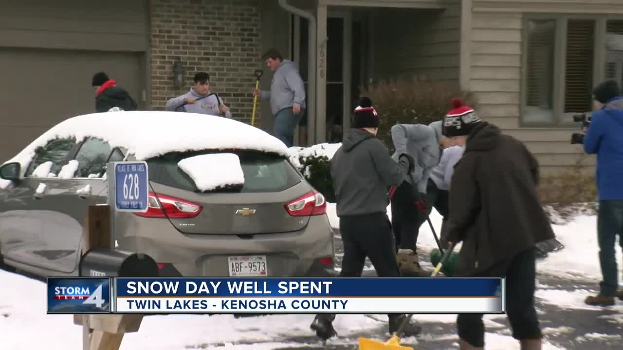 Wilmot Union High School football team spends snow day shoveling driveways