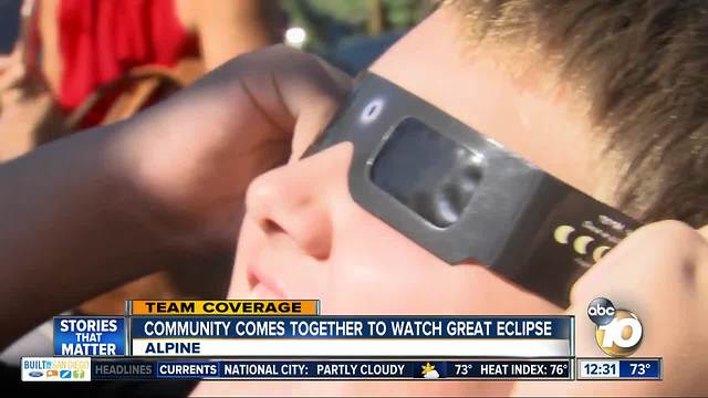 Alpine community members come together to view eclipse