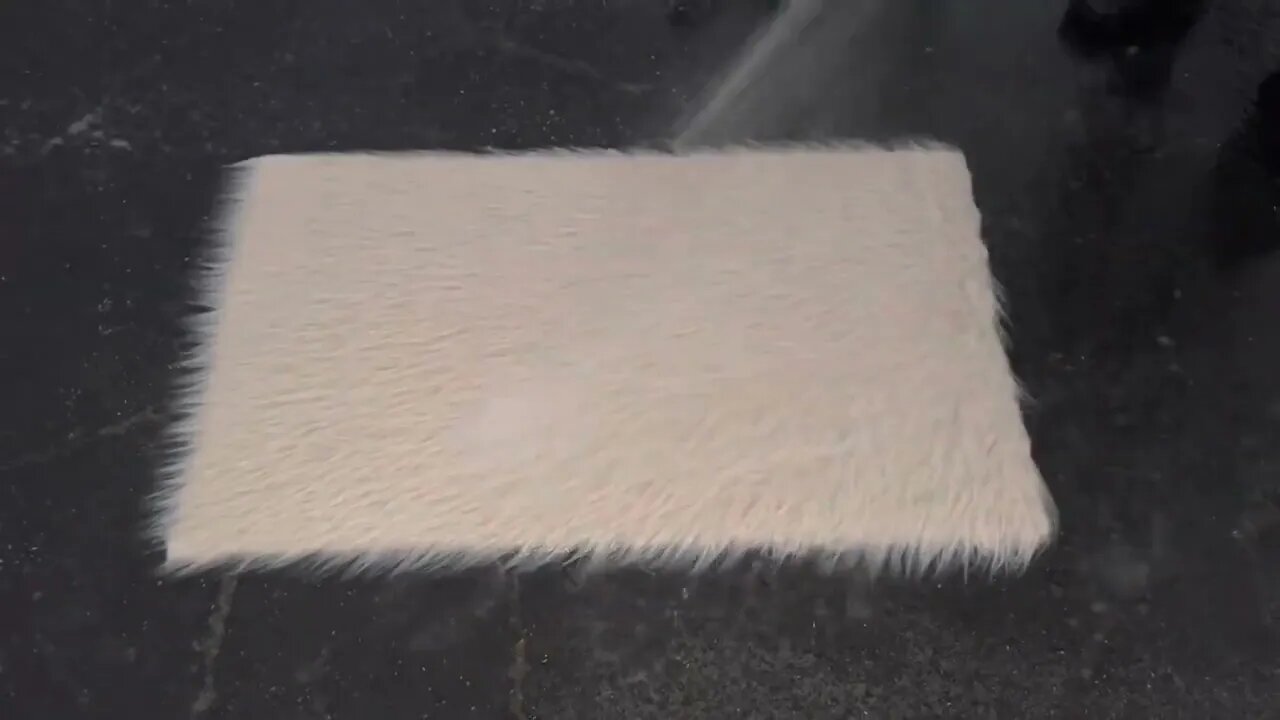 Oddly satisfying ASMR video of a fluffy white rug being washed. Carpet scraping, brushing, scrubbing