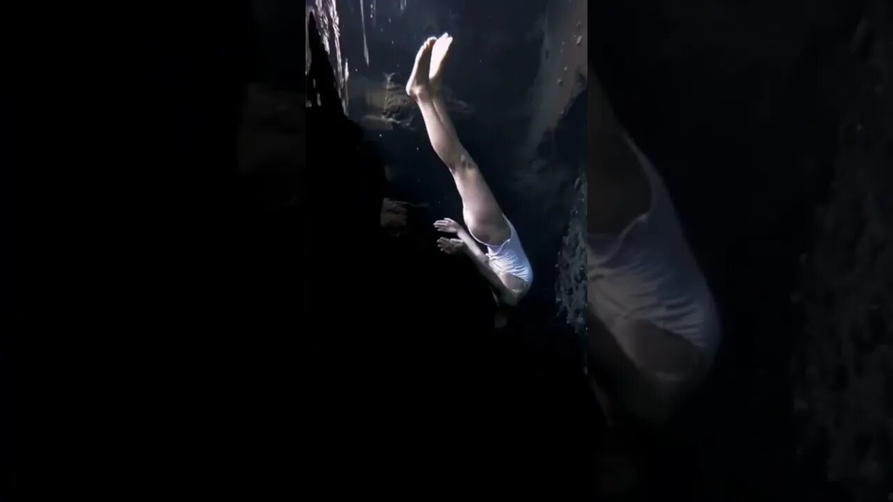 Chinese Girl Swims Around Cave