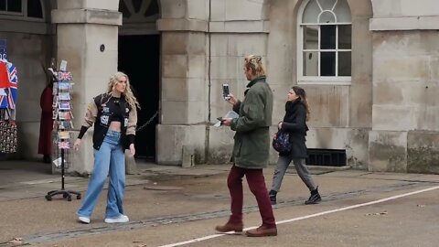 girl dances in front of the kings guard