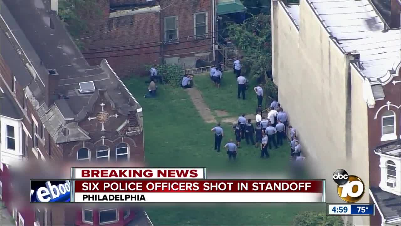 Six police officers shot in standoff