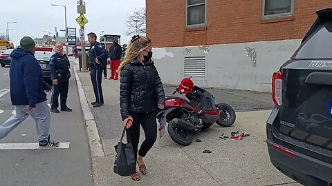 Boston police respond to a motor vehicle accident involving a scooter on Center Street