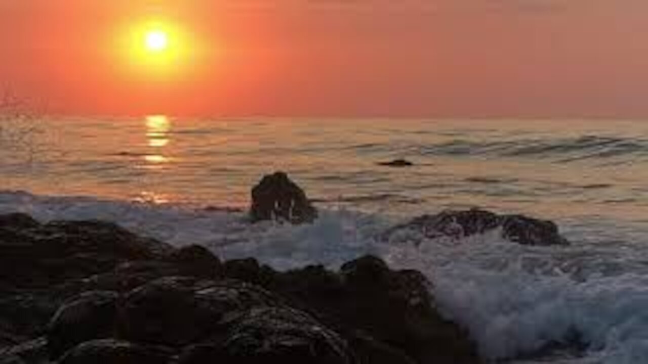 Very beautiful sunset on the sea and waves