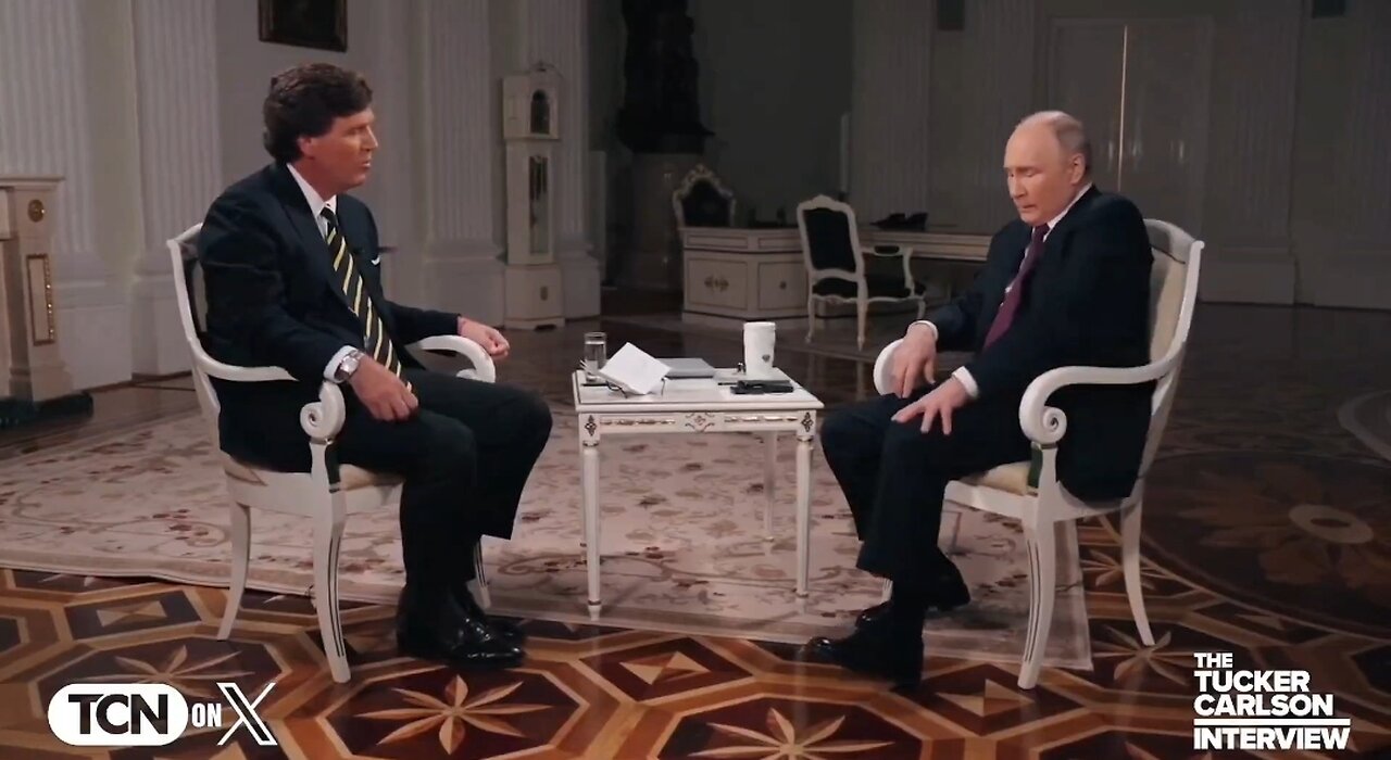 Putin Uses His Hand To Stop His Leg From Shaking During Tucker Interview