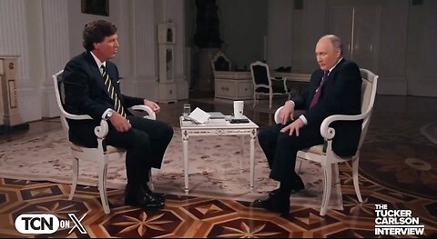 Putin Uses His Hand To Stop His Leg From Shaking During Tucker Interview