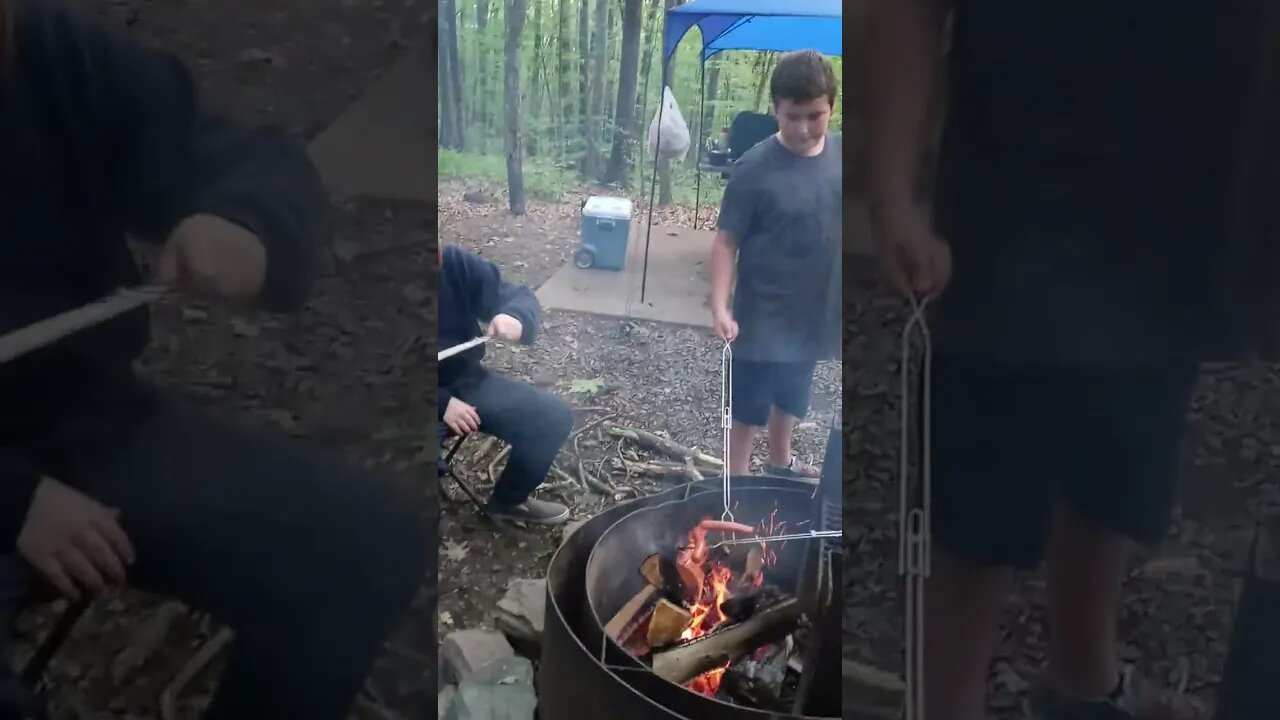 camp out with the grandsons cooking hot dogs