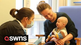 Baby undergoing hospital treatment laughs while underdoing musical therapy