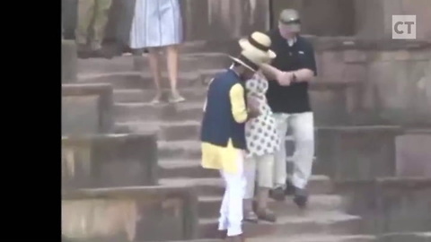 Hillary Looks Like Ragdoll as Legs Give Out on Stairs