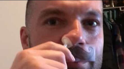 Man uses wax to remove nose hairs