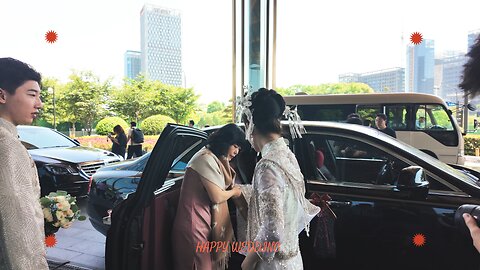 A Chinese Bride and Groom leaving on their wedding day.