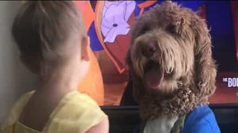 Little girl and her dog recreate Disney movie scene