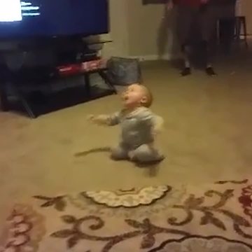 Dizzy Baby Boy Falls on His Back When He Tries to Stand Up
