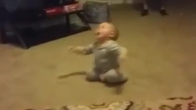 Dizzy Baby Boy Falls on His Back When He Tries to Stand Up