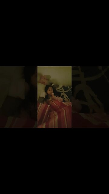 Sweet baby girl eats ice cream even though she is so sleepy