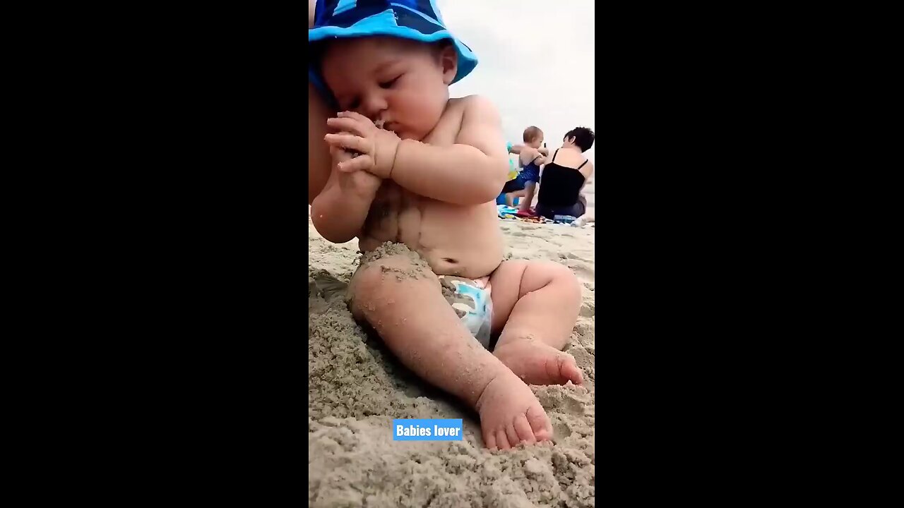 Funny Baby Reaction On The Beach.