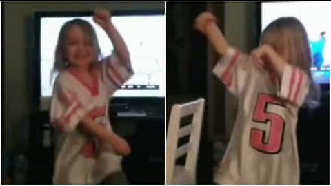 Mini Eagles fan does a victory dance