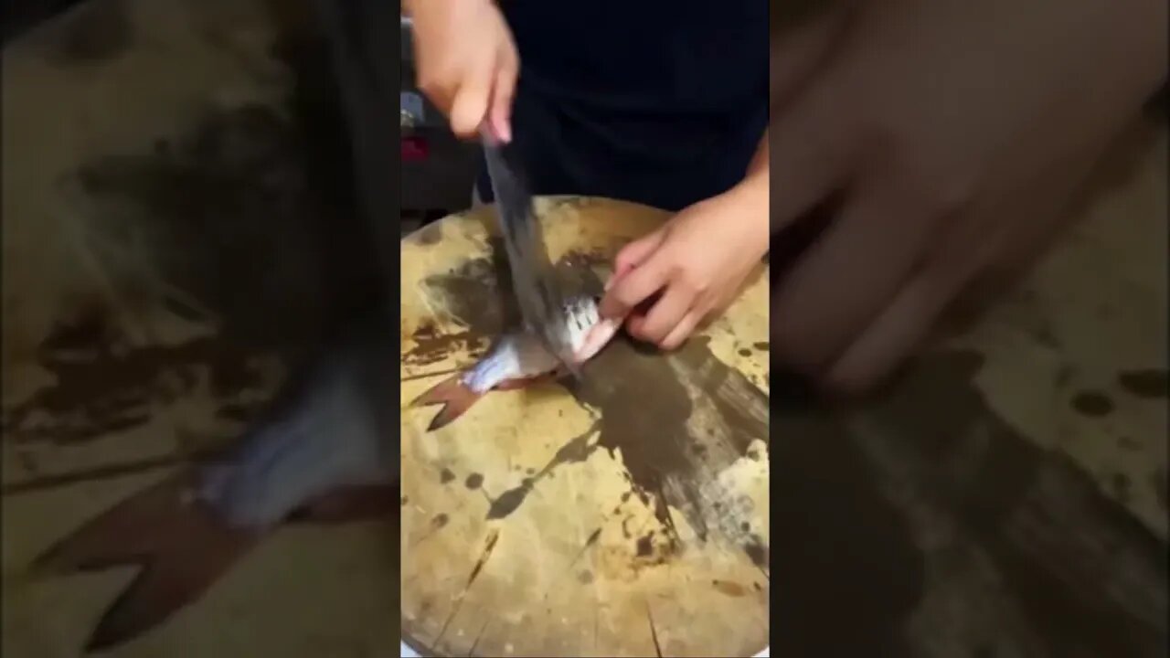 Beautiful Chinese Girl Chef Is Quick With A Knife Cutting Up A Little Fish Part 1