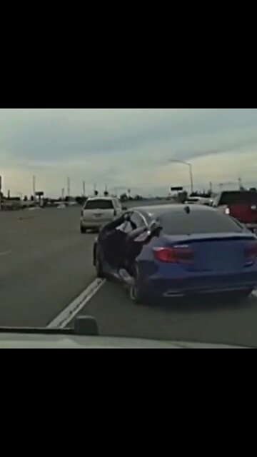 Suspect Clings To Moving Car While Being Chased By Cops